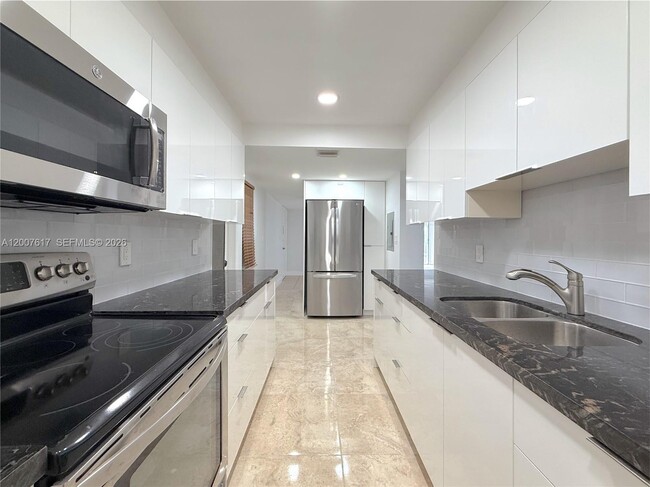 Building Photo - 1075 92nd St Unit 201