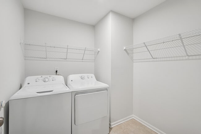 Laundry room with full-size washer and dryer