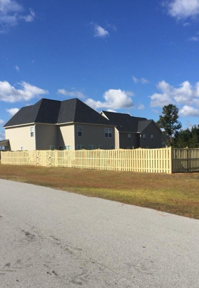back side of home - 100 Pine Lakes Drive
