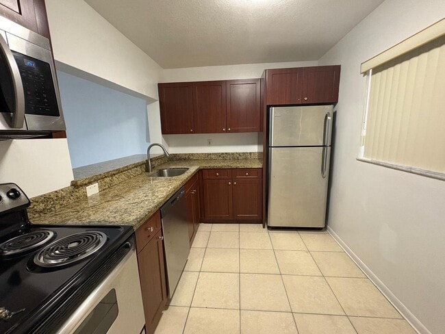 Building Photo - 8400 SW 133rd Avenue Rd Unit 308