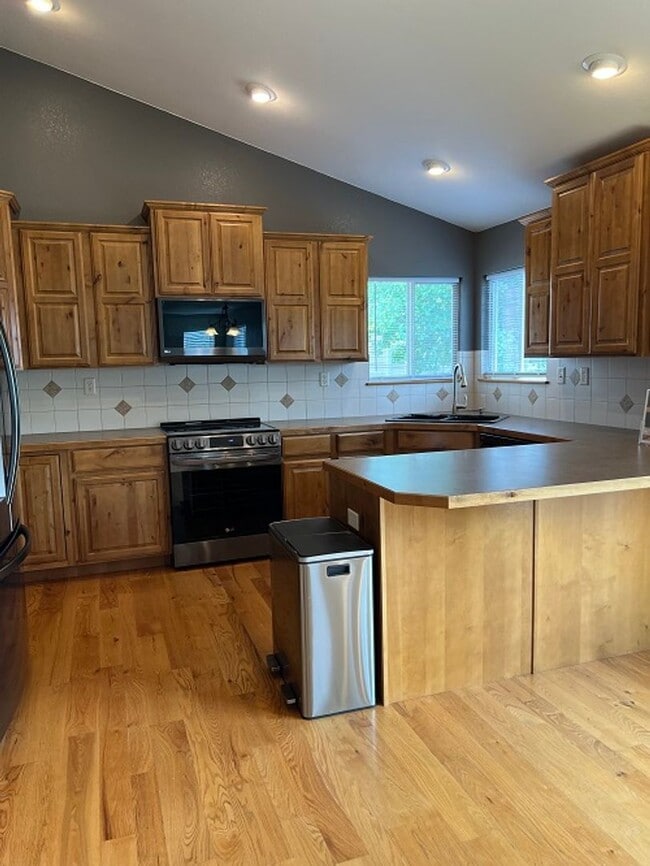 Photo - Spacious 5-Bedroom Home with Finished Basement and 3-Car Garage in Wellington