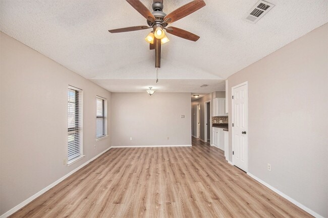 Photo - Modern duplex featuring three bedrooms and two bathrooms with an attached garage.