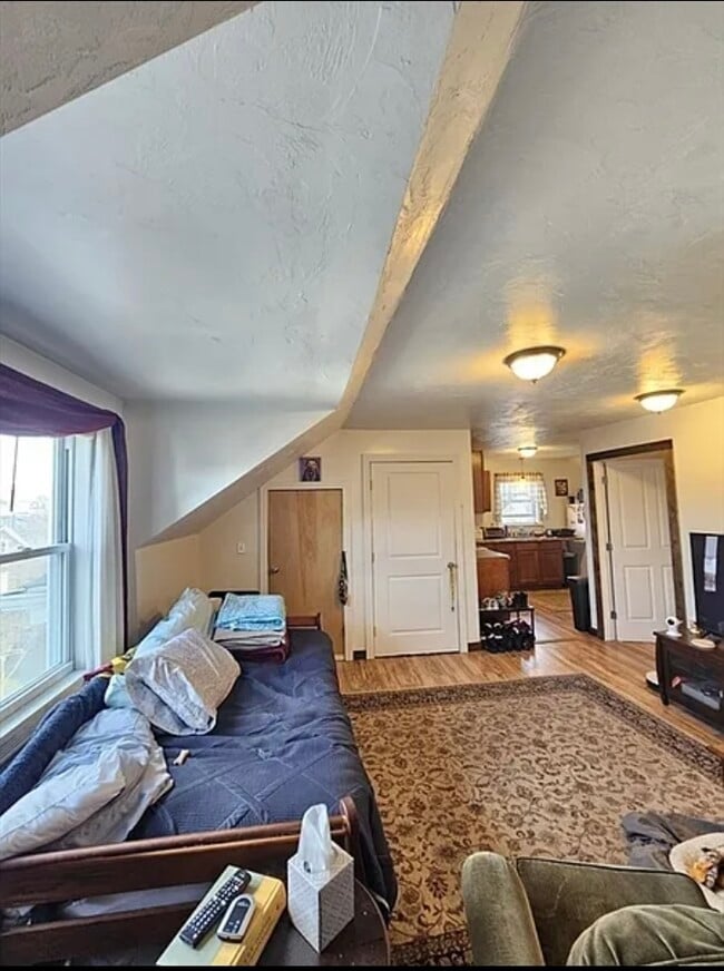 Side entrance doorway leads to living room - 81 Morton St Unit 3rd floor