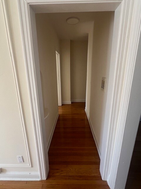 Hall from living room to beds and bath - 4604 Grove St Unit B1