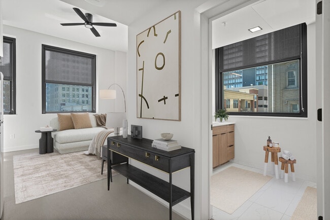The bathroom and living space of The Broadway at Midland Lofts - Midland Lofts