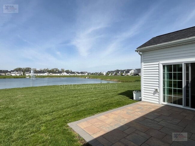 Photo - Beautiful 3BR Home with Pond Views, Modern Finishes & Low-Maintenance Living