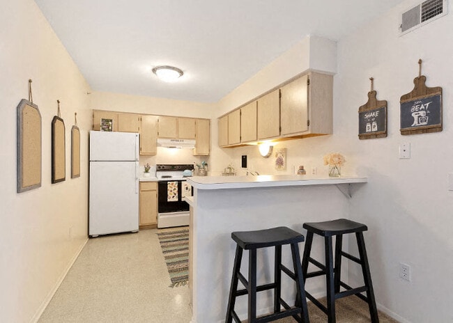 Cozy Breakfast Bar Kitchen at Dover Hills Apartments in Kalamazoo. MI - Dover Hills Apartments
