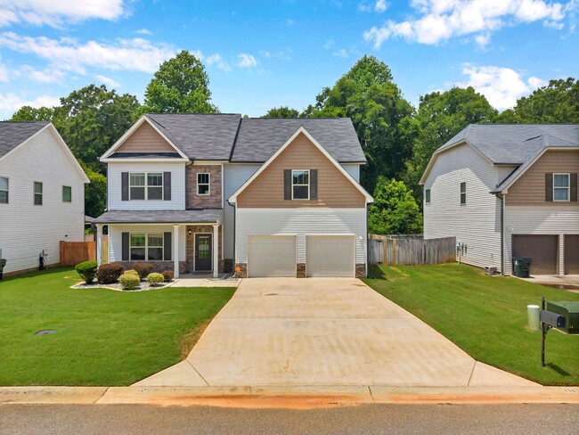 Building Photo - Spacious 4BR Home with Fenced Yard & Community Pool