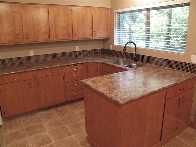 Very large kitchen with glass tile backsplash - 9604 SW Morrison St Apartments