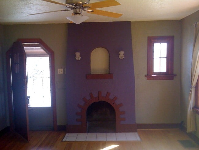 Wood trim, fireplace, ceiling fan - charm and function! - 3909 Perry Street