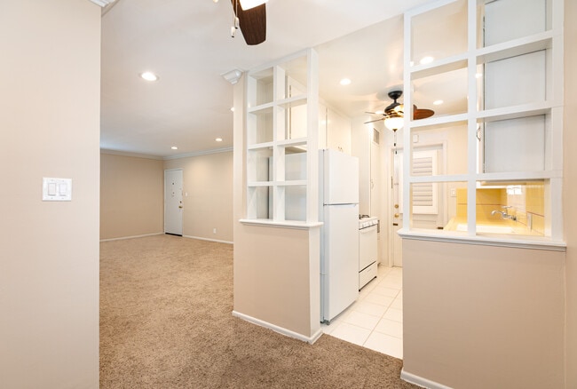 view looking at living room with front door in distance - 1317 19th St Unit C
