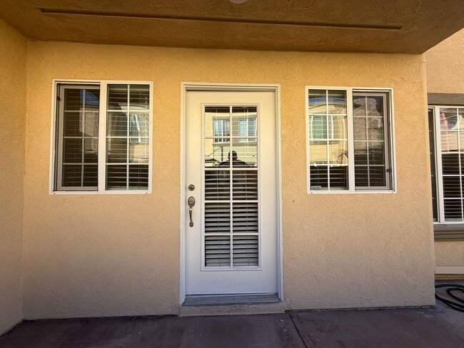 Building Photo - Upgraded Condo with Private Patio, AC, Pool, Gym, and Covered Parking in Gated Community