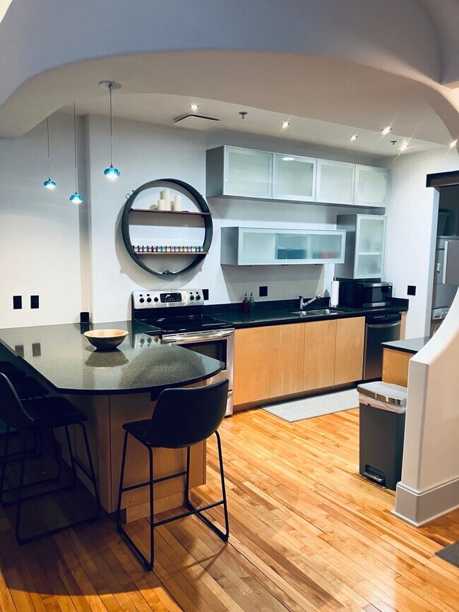 Photo - Turn-Key Downtown Asheville Condo | Historic Old Penney’s Building | Rooftop Views