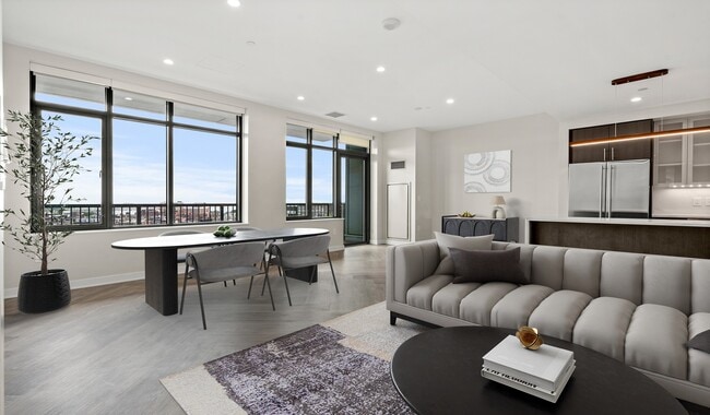 Penthouse kitchens feature quartz countertops and breakfast bars