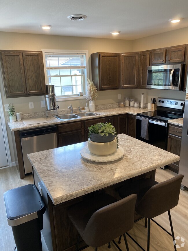 fully appointed kitchen, fridge not in view, but provided (side by side with ice/water in door) - Pleasant View Apartments on Carroll Creek