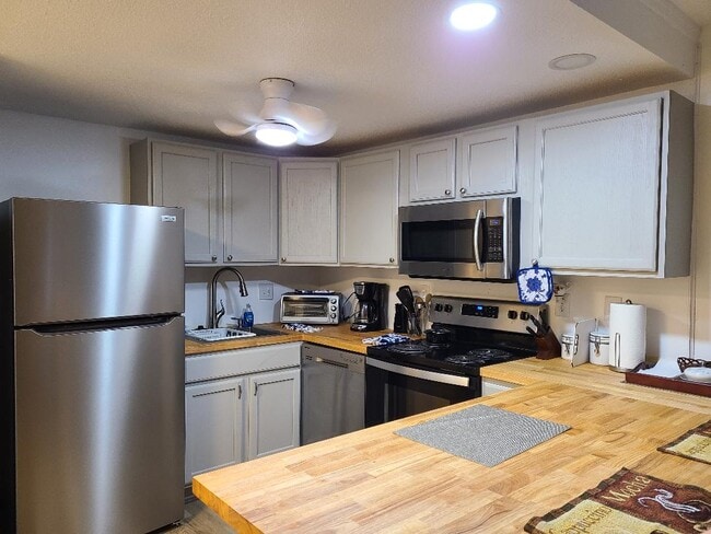 new kitchen - 2100 Kanawha Ave SE Unit 210