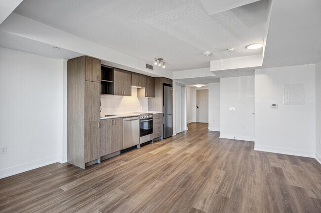 Building Photo - VERY SPACIOUS  bachelor Unit 203
