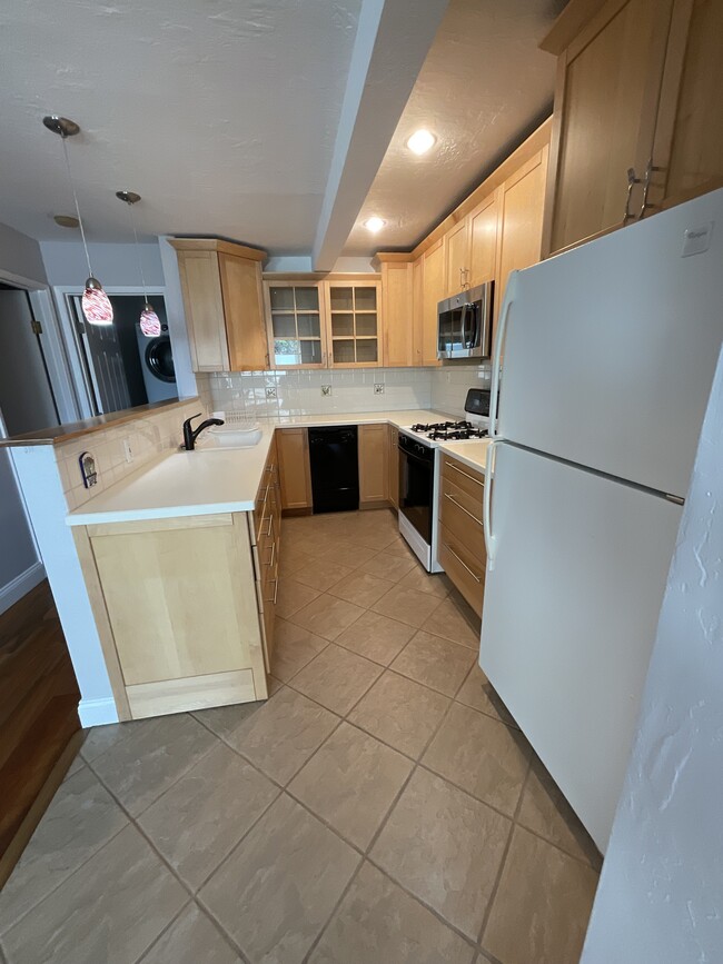 Garbage Disposal, dishwasher, microwave, gas range and full size refrigerator - 2452 Harding Ave Unit 2452A