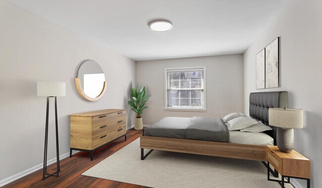 Spacious bedrooms with wood flooring throughout
