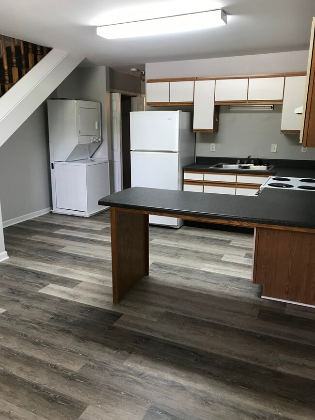 kitchen/living room combo with stackable washer/dryer in some 2bedroom units