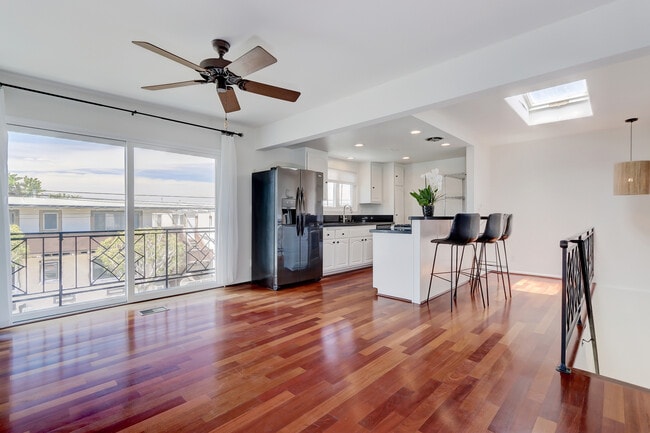 Spacious great room with open kitchen and balcony. - 744 12th St Unidad 744 12th St