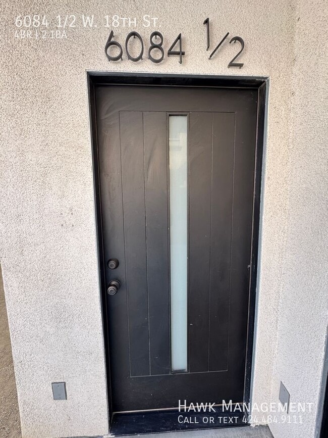 6084 1/2 W. 18th St.-