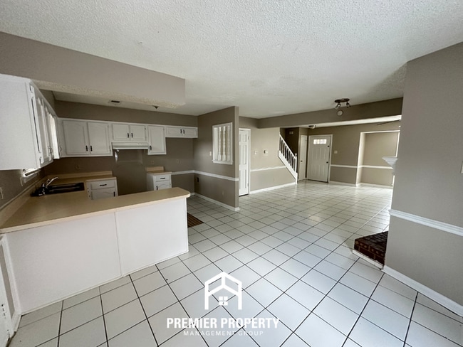 Photo - Charming 2BR/2.5BA Townhome | Dual Primary Suites, Fireplace & Fenced Yard