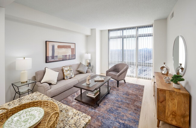 The Ellington living room is transformed with modern vinyl plank wood-style flooring and an updated lighting package. The space feels bright and airy, controlled by a new Google NEST thermostat for effortless climate management. - Meridian at Grosvenor Station
