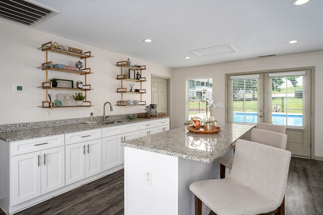 Prepare meals in style with white cabinetry and elegant marble countertops, professionally operated by Highlands Vista Group.
