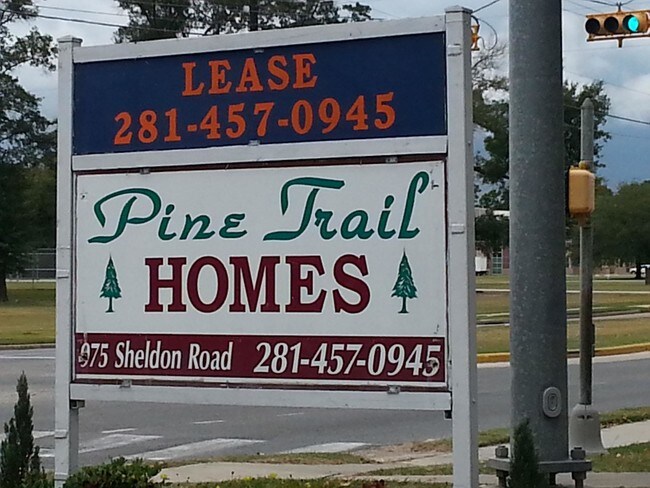 Sign - Pine Trail Homes - Cottage and Town Homes