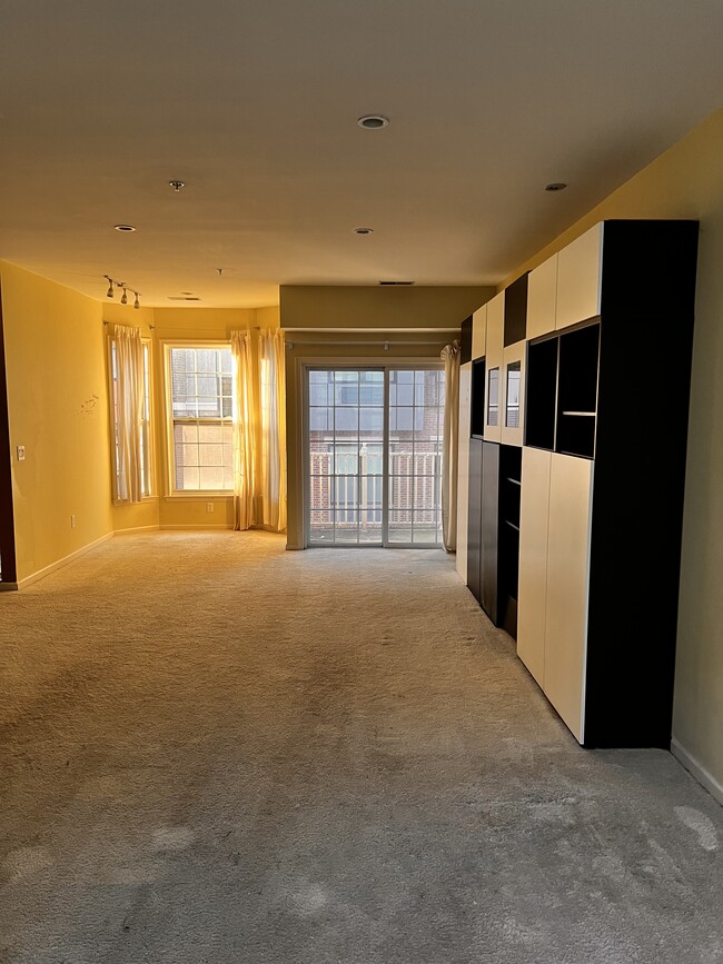 Living Room with Balcony - 201 Dey St Townhome