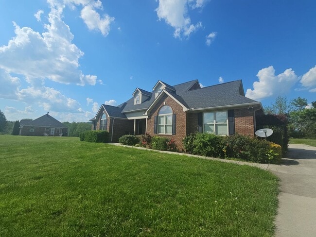 Photo - Bright 3-Bedroom Home with Sun Room, Fireplace & Two-Car Garage