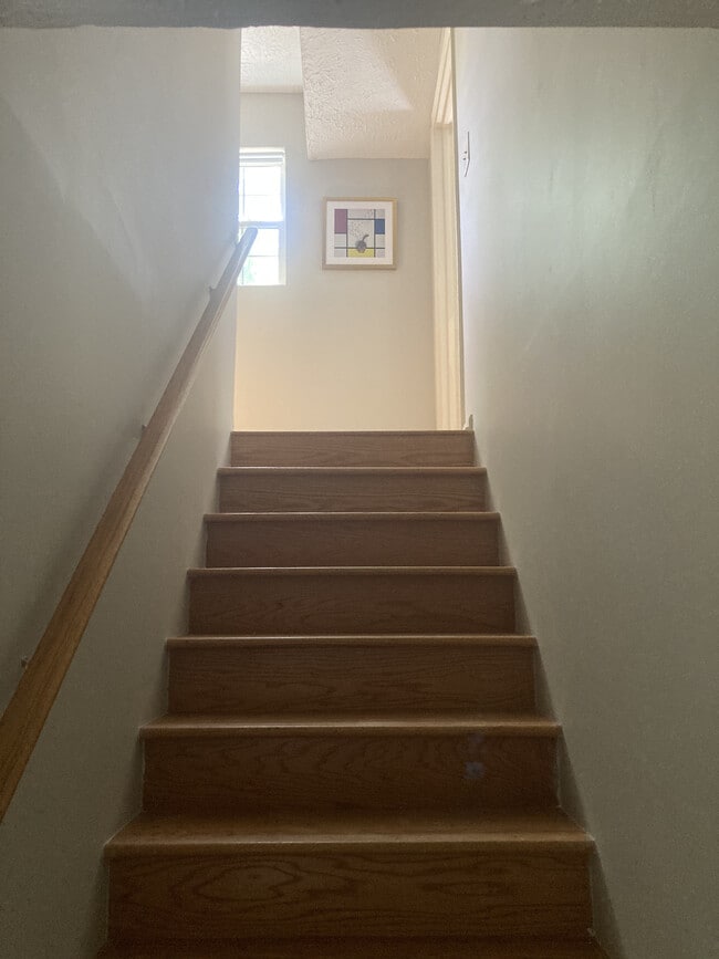 Upstairs to bedrooms, full bathroom and laundry - 2255 Winterville Rd Unit C