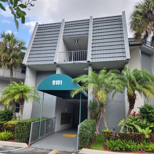 Building Photo - 9101 Lime Bay Blvd Unit 305