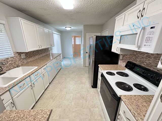 Photo - Spacious 4-Bedroom Gem with 2,320 Sq Ft of...