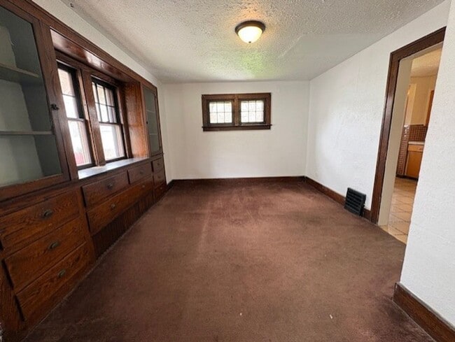Photo - Spacious 4-Bedroom Akron Home with Charming Kitchen Nook & Backyard & Pet Friendly