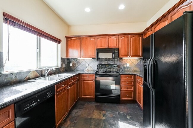 Photo - 3155 E 104th Ave