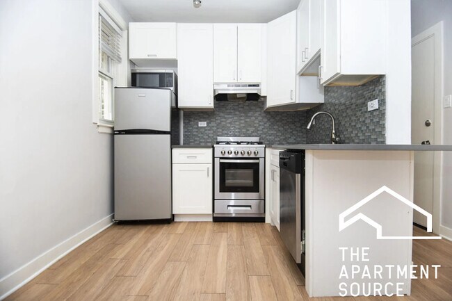 Building Photo - 511 W Belmont Ave Unit 34