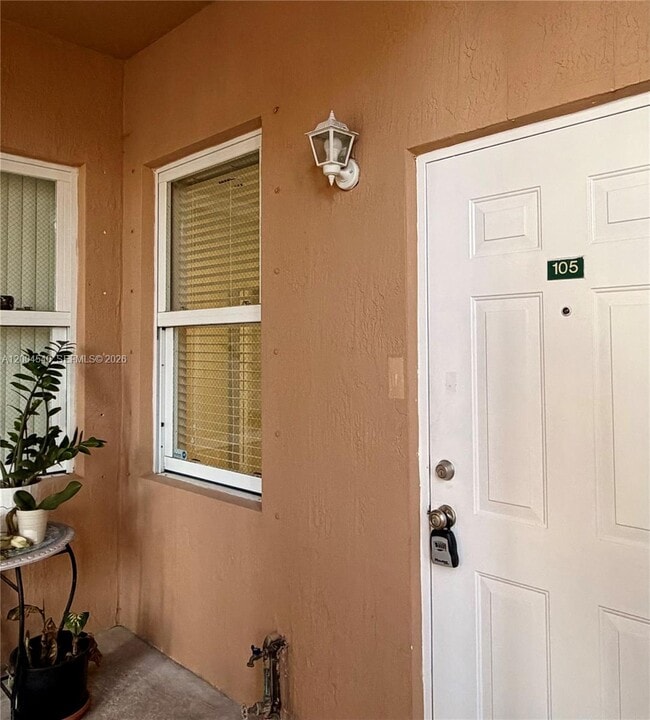 Building Photo - 7130 NW 177th St Unit 105-8