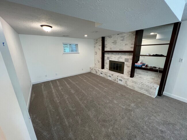 Living Room (New Carpet) - 1632 S Sunset Dr Unit Basement Apartment