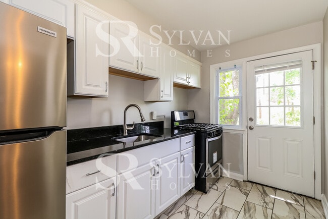Photo - Lovely move-in ready 4-bedroom, 2-bath townhouse.