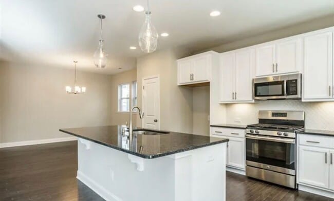 Photo - Beautiful & Open 4 Bedroom + 2.5 bath home with Loft!