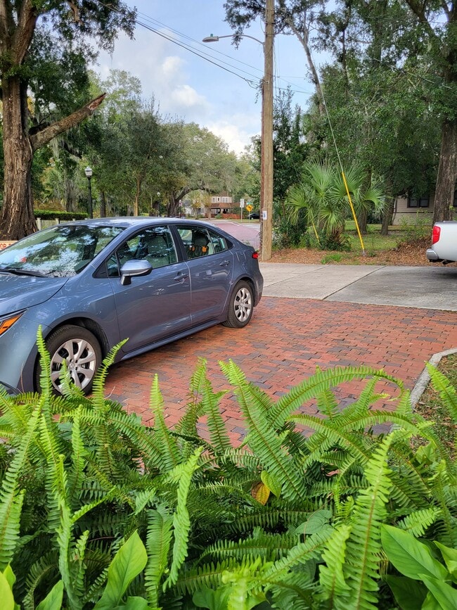 Brick overflow parking for 2 additional vehicles - 1210 E Jackson St