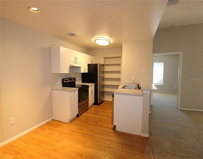 Building Photo - 8121 45th Ct E Unit 7