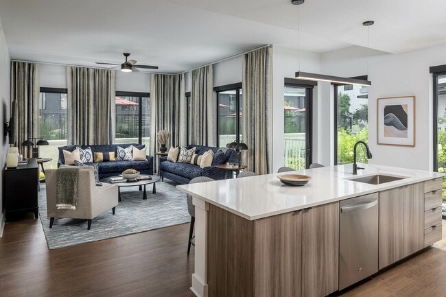 Open floorplan living rooms with Kember wood-style floors