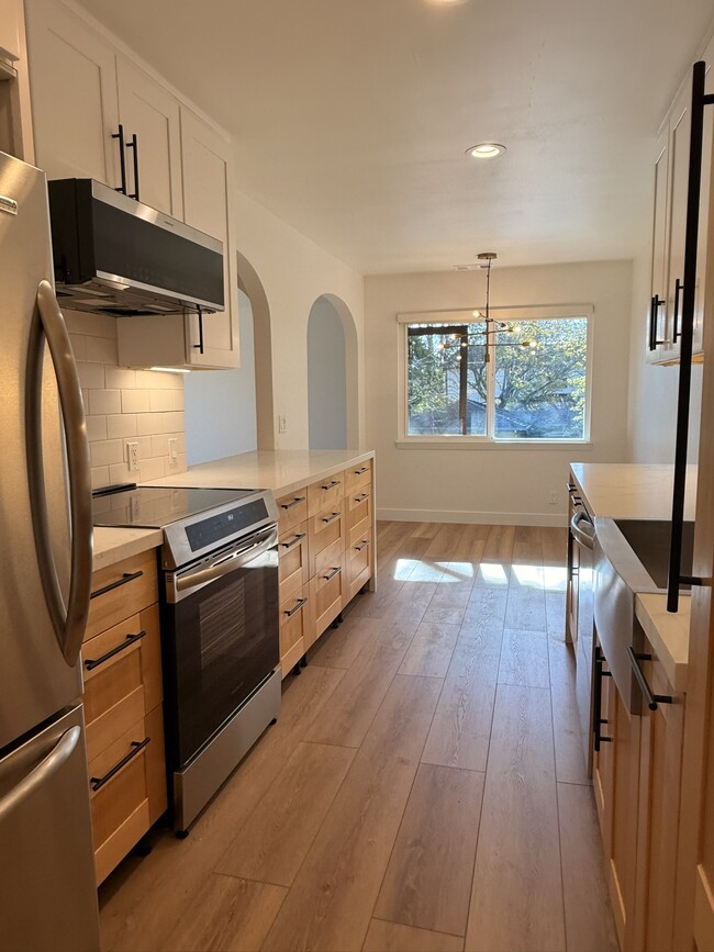 New induction range and modern vented microwave - 496 Sherwood Way Unit Apartment 3