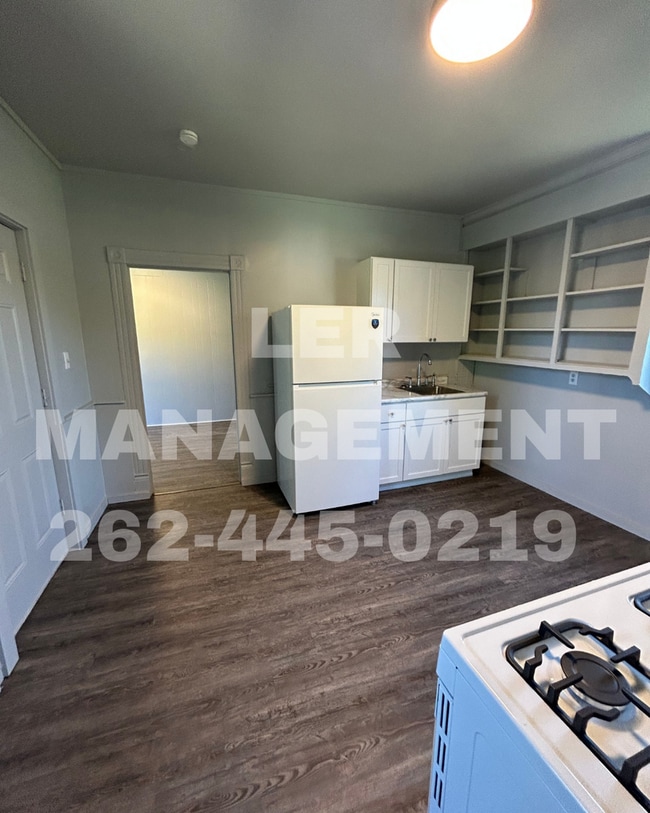 Building Photo - 6745 14th Ave Unit #2