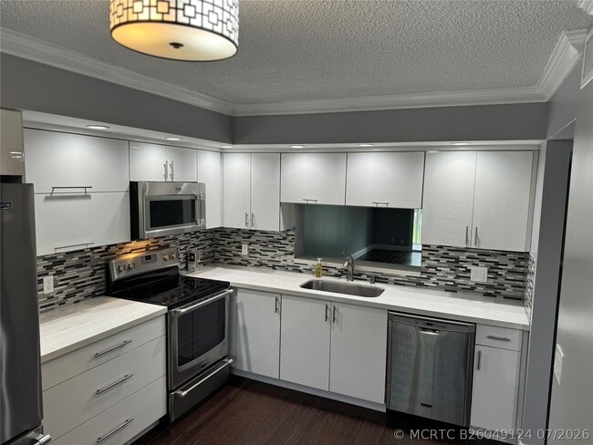 Building Photo - 12750 SW 4th Ct Unit 310j