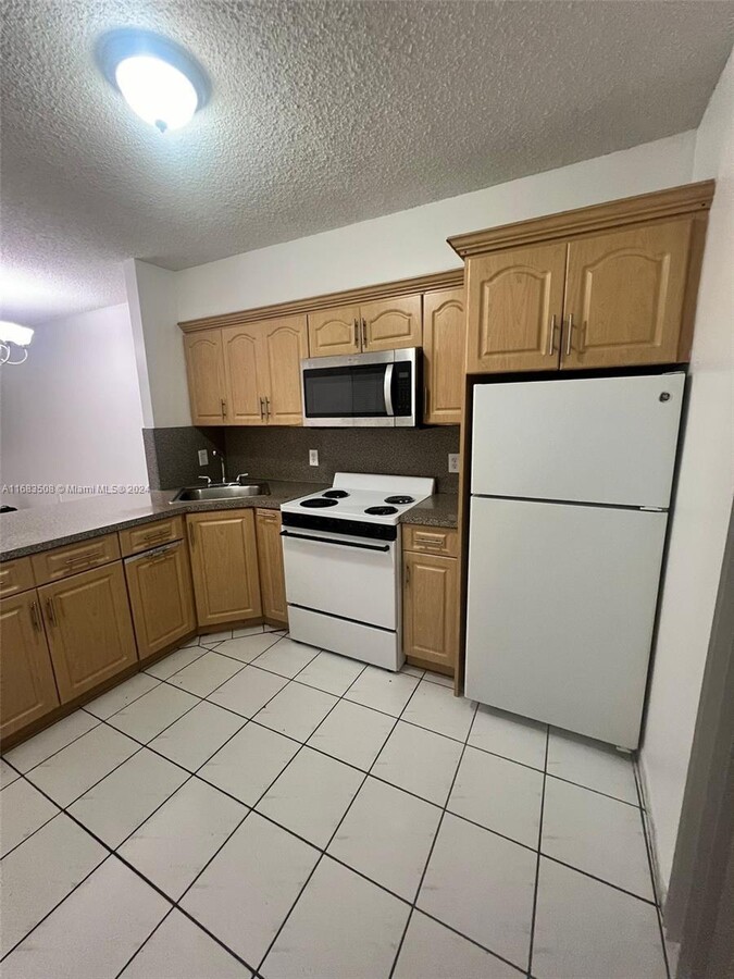 Photo - 5480 W 21st Ct Condo Unit 104