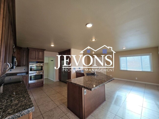 Photo - Move-in Special: $500 off your first month’s rent. Cozy 4-bedroom home with a fully equipped kitc...